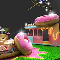 Giant Donut Themed Food Truck With Pink Frosting And Sprinkles On Green Grass