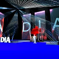 DIA Event Scene With Radial Lines Purple Blue Background And Human Figure Standee