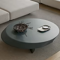 Modern Gray Round Coffee Table With Dried Branches And Tray On Carpet