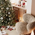 Cozy Recreation Room Interior With Decorated Christmas Tree Wreath Reindeer Figurines And Plush Chair