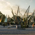 Modern Garden Art Installations With Metal Glass Frames Cacti Trees Gravel Ground And People