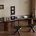 Modern Interior Design With Glass Table Stools Laptop Books And Potted Plant