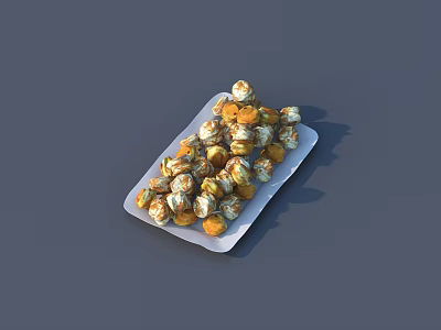 Gold And White Wrapped Candies Neatly Arranged On A White Plate 3d model