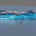 Blue Wave Shaped Glass Sculpture with Person Water Reflection and Mountain Sky