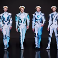 Group of Four Male Models Wearing Futuristic Blue And White Outfits Walking on Dark Runway