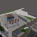 Vibrant Commercial Street Plaza With Stage Orange Chairs And Green Trees
