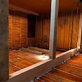 Unfinished Interior Construction With Wooden Framing Floor Joists Wall Studs And Electrical Wiring