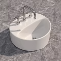 Round White Ceramic Bathroom Washbasin with Faucet on Marble Surface