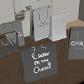 Luxury Shopping Bags With Valentino Chanel Branded Designs On Wooden Table