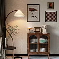 Cozy Buffet Cabinet with Glass Doors Floor Lamp Table Lamp Coffee Machine and Wall Paintings