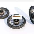 Detailed View of Three Motorcycle Tires with Wheels and Spokes on White Background