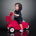 Little Girl Riding Red Toy Scooter With Basket On Black Background
