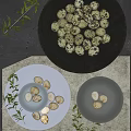 Elegant Dishware Set Featuring Black Gray Bowls Plates With Quail Eggs And Green Foliage