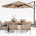 Stylish Outdoor Table with Woven Chairs Large Umbrella Decorative Vase and Fresh Fruits