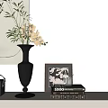 Black Vase With Yellow Orchid Flowers Framed Art Books And Cup On White Wall
