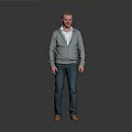 Man Standing In Gray Background Wearing Gray Cardigan White Shirt Blue Jeans And Brown Shoes