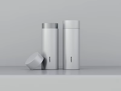 Stainless Steel Cups In Minimalist Design Two Upright With One Lid On Table 3d model