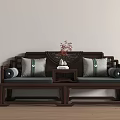 Traditional Chinese Dark Brown Wood Daybed Featuring Carved Backrest Green Gray Pillows And Tea Table