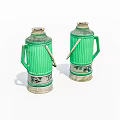 Two Green Striped Thermos Flasks With Metal Handles And Stable Base For Daily Household Use