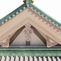 Ancient Architecture Roof with Intricate Carved Patterns on Wooden Beams and Green Tiles