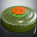 Green Circular Military Weapon Device With Orange Top And Identification Markings 3d model