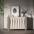 Entryway Side Cabinet with Geometric Design and Decorations Including Leaf Artwork and Green Plants
