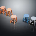 Five Different Colored Wooden Stools In Orange Light Brown Blue And White