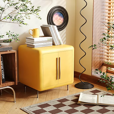 Stylish Yellow Leather Nightstand with Cabinet Doors Metal Handles Stacked Books Yellow Mug Green Plants 3d model