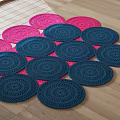 Stylish Shaped Rugs Display With Pink And Blue Circular Woven Patterns On Wooden Floor