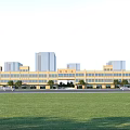Modern Commercial Street With Multi story Buildings Green Trees Open Lawn And Blue Sky