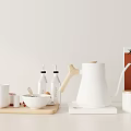 Minimalist White Kitchenware Collection With Kettle Mugs Bowl Bottles And Coffee Canisters On Tray