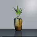 Potted Bonsai Plant With Green Leaves In Brown Blue Ceramic Pot On Smooth Gray Surface