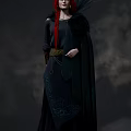 Woman With Red Hair Long Braid Black Off Shoulder Top And Feather Decoration On Shoulders