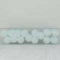 Transparent Acrylic Stool Filled With White Balls On Light Wooden Table