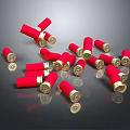 Shiny Red Bullet Casings With Gold Bottoms Scattered On Black Background Surface