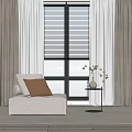 Light Gray Bean Bag Chair With Brown Cushion By Window And Gray Curtains