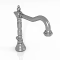 Three Metal Kitchen Faucets with Blue and Red Knobs on White Surface