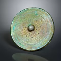 Ancient Bronze Mirror With Intricate Patterns Central Knob And Green Patina