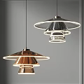 Modern Copper and Silver Pendant Lights with Illuminated Ring Shades in Minimalist Interior