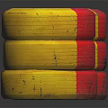 Stacked Yellow and Red Tires with Black Centers on Dark Reflective Background
