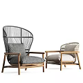 Stylish Pair of Woven Armchairs With Wooden Frames And Soft Neutral Cushions