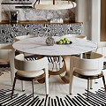 Round White Marble Dining Table And Chairs Set With Black And White Zebra Pattern Rug And Elegant Gold Legs