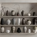 Ceramic Vessels on Multiple Shelves Display Various Shapes Colors and Textured Designs in Minimalist Style