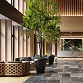Modern Hotel Lobby Interior With Chandelier Green Plants And Wooden Panels
