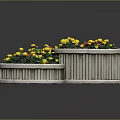 Three Circular Wooden Planters With Lush Yellow And Red Flowers And Green Plants