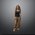 Red Haired Woman Wearing Black Tank Top Brown Pants Standing On Reflective Floor Gray Background