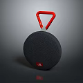 Portable JBL Computer Speaker With Black Circular Body Red Hook And Textured Surface