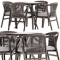 Modern Round Wooden Table With Four Woven Back Chairs And Gray Cushions Metal Legs