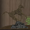 Abstract Golden Horse Sculpture Dynamic Leaping Pose With Black Stone Base And Green Plant Decor