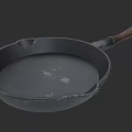 Durable Cast Iron Frying Pan With Wooden Handle And Textured Surface
